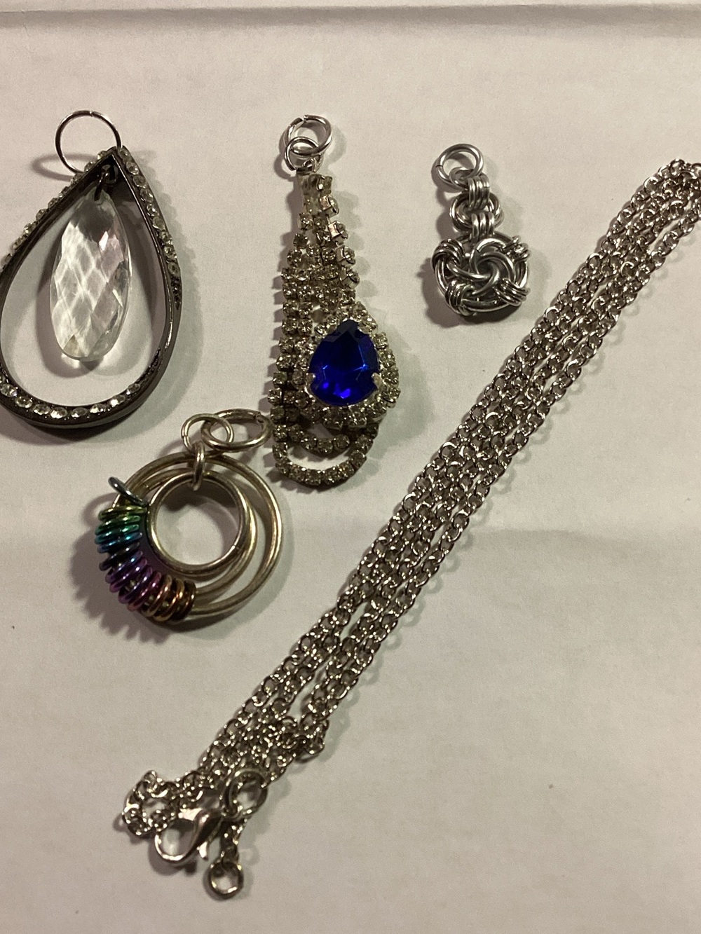 Interchangeable  silver toned pendant (s): 4 total with chain